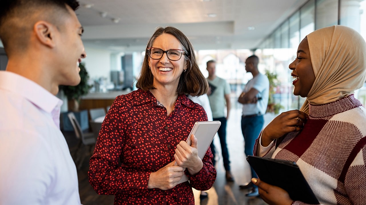 Three colleagues talking