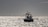 Een vissersboot bij Vlissingen bij ondergaande zon, met windturbines op de horizon (Foto: Marcel Burger)