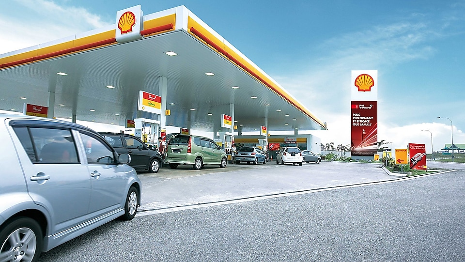 Photo of car driving up to a Shell retail station