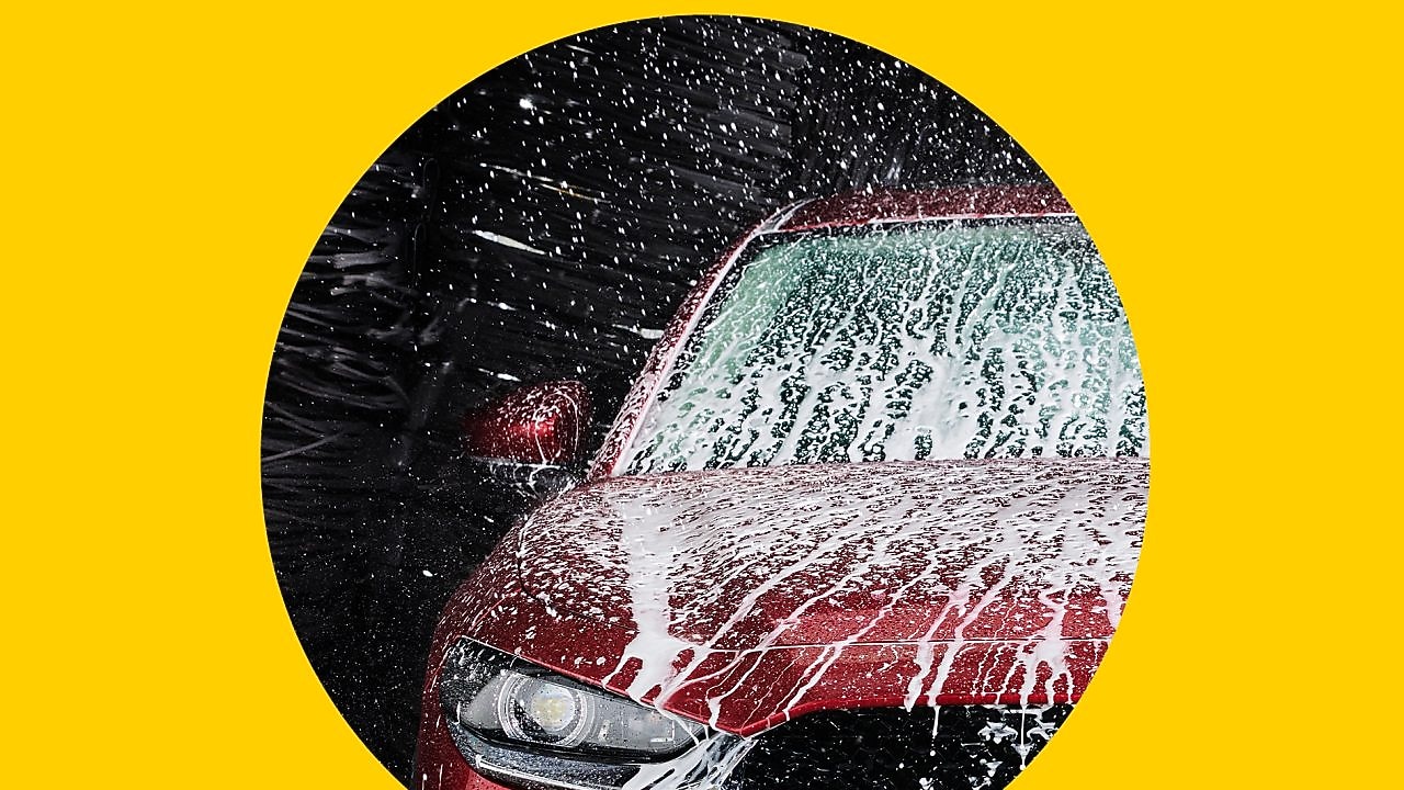 A boy sitting inside the car