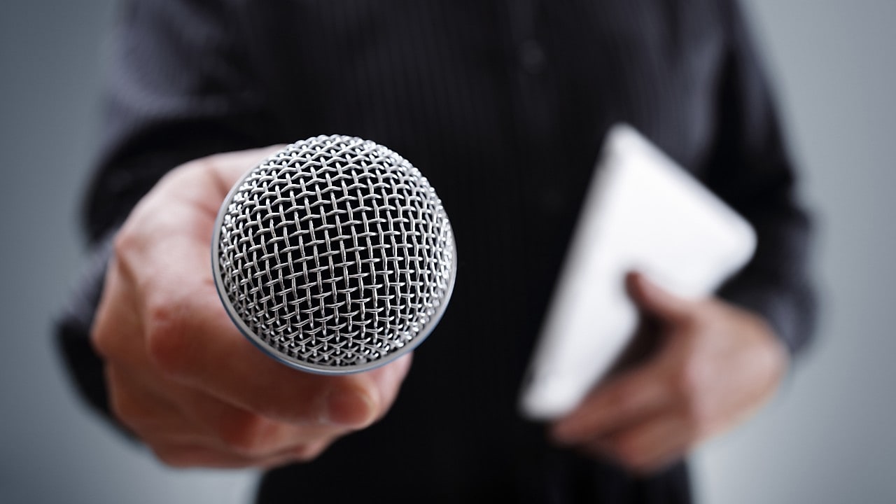 A microphone and an interviewer