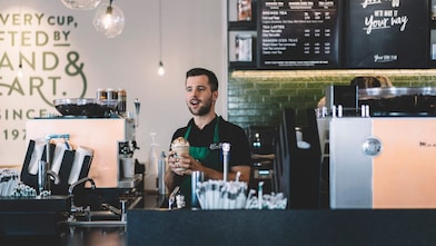 man behind the counter at starbucks
